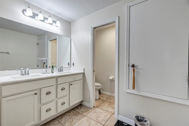 Welcome to a life that feels like vacation every day. Nestled in on Arlington Ridge Golf Club in Florida - for sale on GolfHomes.com, golf home, golf lot