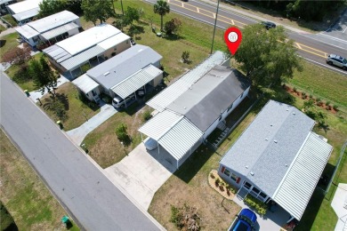 2002 Perimeter lot home. With 3-bed, 2-bath featuring desirable on Barefoot Bay Golf Course in Florida - for sale on GolfHomes.com, golf home, golf lot