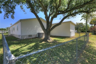 2002 Perimeter lot home. With 3-bed, 2-bath featuring desirable on Barefoot Bay Golf Course in Florida - for sale on GolfHomes.com, golf home, golf lot