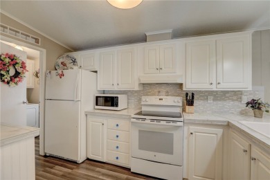 2002 Perimeter lot home. With 3-bed, 2-bath featuring desirable on Barefoot Bay Golf Course in Florida - for sale on GolfHomes.com, golf home, golf lot