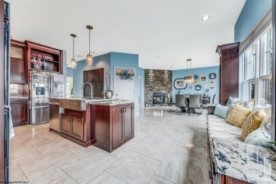 This exquisite home welcomes you through the custom Mahogany on Uniontown Country Club in Pennsylvania - for sale on GolfHomes.com, golf home, golf lot