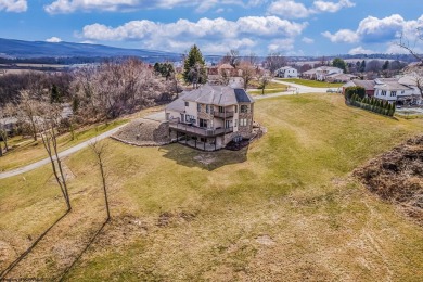 This exquisite home welcomes you through the custom Mahogany on Uniontown Country Club in Pennsylvania - for sale on GolfHomes.com, golf home, golf lot