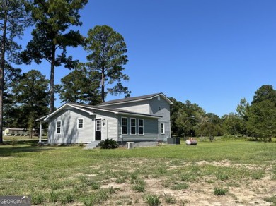 Enjoy country living in this beautifully remodeled home on 2 on Green Acres Golf and Recreation Club in Georgia - for sale on GolfHomes.com, golf home, golf lot