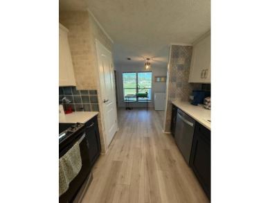 Imagine every day having coffee or lunch on your private deck on Hamptons Golf Club in Florida - for sale on GolfHomes.com, golf home, golf lot