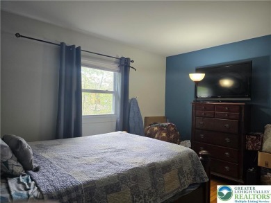 This 4 bedroom, 2 bath split level home sits in an amenity on Pocono Farms Country Club in Pennsylvania - for sale on GolfHomes.com, golf home, golf lot
