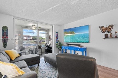 Spectacular remodeled first-floor condo with stunning lake view on Sunrise Lakes Phase III in Florida - for sale on GolfHomes.com, golf home, golf lot