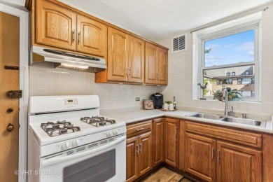 Welcome home to this desirable second floor corner unit drenched on Robert Black Golf Course in Illinois - for sale on GolfHomes.com, golf home, golf lot