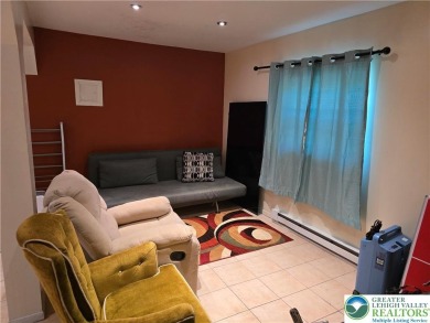 This 4 bedroom, 2 bath split level home sits in an amenity on Pocono Farms Country Club in Pennsylvania - for sale on GolfHomes.com, golf home, golf lot