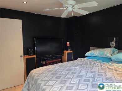 This 4 bedroom, 2 bath split level home sits in an amenity on Pocono Farms Country Club in Pennsylvania - for sale on GolfHomes.com, golf home, golf lot