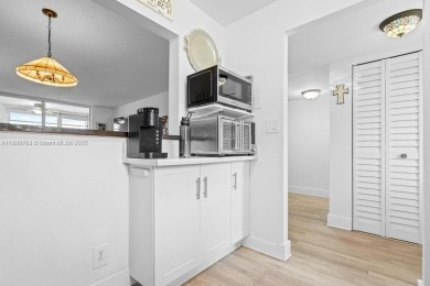 Spectacular remodeled first-floor condo with stunning lake view on Sunrise Lakes Phase III in Florida - for sale on GolfHomes.com, golf home, golf lot