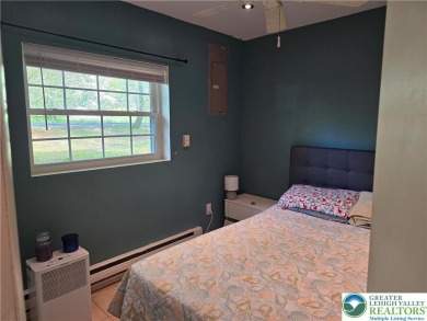 This 4 bedroom, 2 bath split level home sits in an amenity on Pocono Farms Country Club in Pennsylvania - for sale on GolfHomes.com, golf home, golf lot