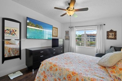 Spectacular remodeled first-floor condo with stunning lake view on Sunrise Lakes Phase III in Florida - for sale on GolfHomes.com, golf home, golf lot