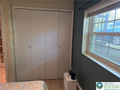This 4 bedroom, 2 bath split level home sits in an amenity on Pocono Farms Country Club in Pennsylvania - for sale on GolfHomes.com, golf home, golf lot
