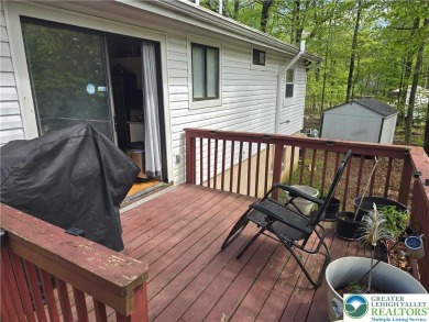 This 4 bedroom, 2 bath split level home sits in an amenity on Pocono Farms Country Club in Pennsylvania - for sale on GolfHomes.com, golf home, golf lot