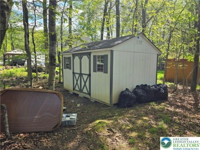 This 4 bedroom, 2 bath split level home sits in an amenity on Pocono Farms Country Club in Pennsylvania - for sale on GolfHomes.com, golf home, golf lot