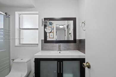 Spectacular remodeled first-floor condo with stunning lake view on Sunrise Lakes Phase III in Florida - for sale on GolfHomes.com, golf home, golf lot