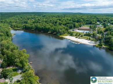 This 4 bedroom, 2 bath split level home sits in an amenity on Pocono Farms Country Club in Pennsylvania - for sale on GolfHomes.com, golf home, golf lot