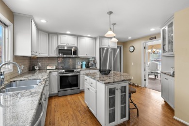 Welcome to a wonderful, classic 2-story home with a walk out on Lake Doster Golf Club in Michigan - for sale on GolfHomes.com, golf home, golf lot