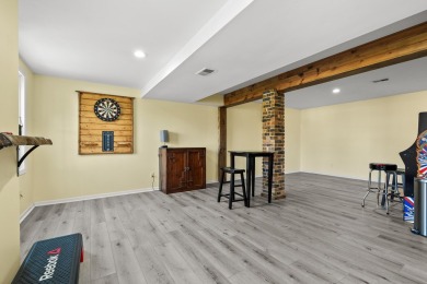 Welcome to a wonderful, classic 2-story home with a walk out on Lake Doster Golf Club in Michigan - for sale on GolfHomes.com, golf home, golf lot