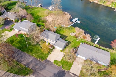 Welcome to a wonderful, classic 2-story home with a walk out on Lake Doster Golf Club in Michigan - for sale on GolfHomes.com, golf home, golf lot