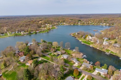 Welcome to a wonderful, classic 2-story home with a walk out on Lake Doster Golf Club in Michigan - for sale on GolfHomes.com, golf home, golf lot
