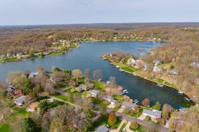 Welcome to a wonderful, classic 2-story home with a walk out on Lake Doster Golf Club in Michigan - for sale on GolfHomes.com, golf home, golf lot