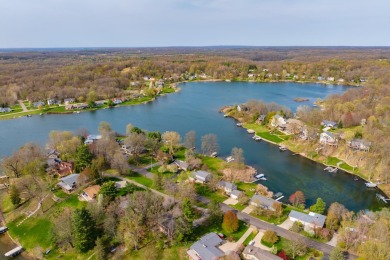 Welcome to a wonderful, classic 2-story home with a walk out on Lake Doster Golf Club in Michigan - for sale on GolfHomes.com, golf home, golf lot