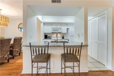 Freshly painted with new LVP and brand-new carpet in June 2023 on Palmetto Dunes Golf Course and Resort in South Carolina - for sale on GolfHomes.com, golf home, golf lot