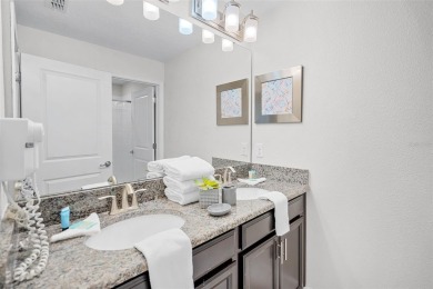 Step into the ultimate vacation lifestyle at 1578 Slice Way, a on The Oasis Club at Champions Gate in Florida - for sale on GolfHomes.com, golf home, golf lot