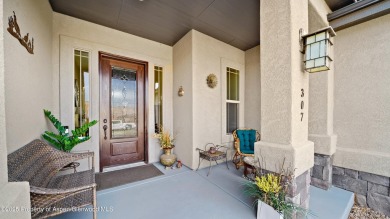 Welcome home to the heart of Redlands Mesa, where breathtaking on The Golf Club At Redlands Mesa in Colorado - for sale on GolfHomes.com, golf home, golf lot