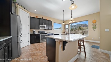 Welcome home to the heart of Redlands Mesa, where breathtaking on The Golf Club At Redlands Mesa in Colorado - for sale on GolfHomes.com, golf home, golf lot