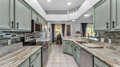 Spend your days under swaying palm trees as you chip, putt and on Huntington Hills Golf and Country Club in Florida - for sale on GolfHomes.com, golf home, golf lot