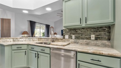 Spend your days under swaying palm trees as you chip, putt and on Huntington Hills Golf and Country Club in Florida - for sale on GolfHomes.com, golf home, golf lot