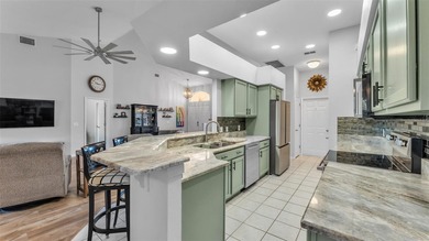 Spend your days under swaying palm trees as you chip, putt and on Huntington Hills Golf and Country Club in Florida - for sale on GolfHomes.com, golf home, golf lot