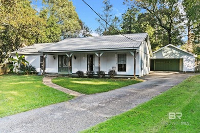 Step inside this spacious 4-bedroom, 2-bath ranch-style home on on Lake Forest Yacht and Country Club in Alabama - for sale on GolfHomes.com, golf home, golf lot