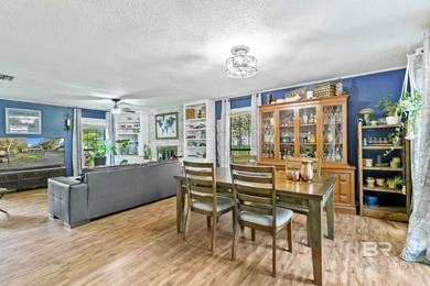 Step inside this spacious 4-bedroom, 2-bath ranch-style home on on Lake Forest Yacht and Country Club in Alabama - for sale on GolfHomes.com, golf home, golf lot