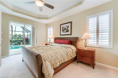 This stunning home features a spacious screened lanai with south on Shadow Wood Country Club in Florida - for sale on GolfHomes.com, golf home, golf lot