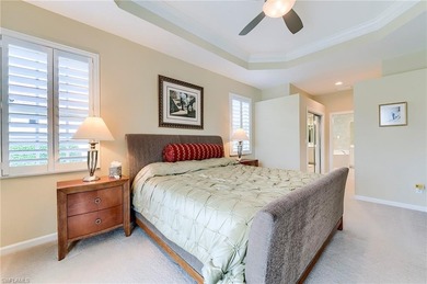 This stunning home features a spacious screened lanai with south on Shadow Wood Country Club in Florida - for sale on GolfHomes.com, golf home, golf lot