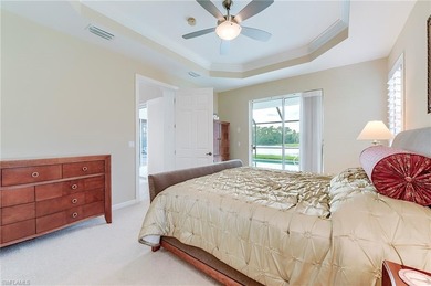 This stunning home features a spacious screened lanai with south on Shadow Wood Country Club in Florida - for sale on GolfHomes.com, golf home, golf lot