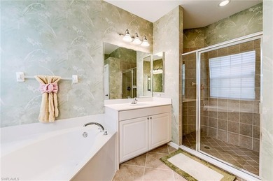 This stunning home features a spacious screened lanai with south on Shadow Wood Country Club in Florida - for sale on GolfHomes.com, golf home, golf lot