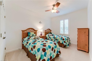 This stunning home features a spacious screened lanai with south on Shadow Wood Country Club in Florida - for sale on GolfHomes.com, golf home, golf lot