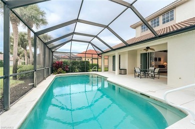 This stunning home features a spacious screened lanai with south on Shadow Wood Country Club in Florida - for sale on GolfHomes.com, golf home, golf lot