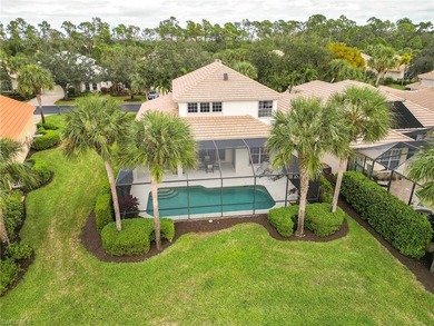 This stunning home features a spacious screened lanai with south on Shadow Wood Country Club in Florida - for sale on GolfHomes.com, golf home, golf lot