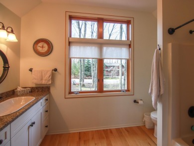 Peaceful and private, this entirely renovated home where no on Crystal Mountain Golf Course in Michigan - for sale on GolfHomes.com, golf home, golf lot