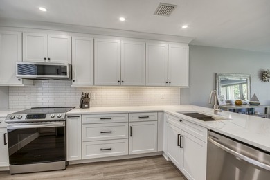 Fabulous modern remodel and premium location with stunning golf on Riverbend Golf Club in Florida - for sale on GolfHomes.com, golf home, golf lot