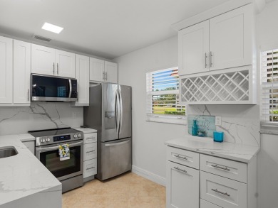 Welcome to this beautifully renovated, turn key, first-floor on The American Golf Club in Florida - for sale on GolfHomes.com, golf home, golf lot