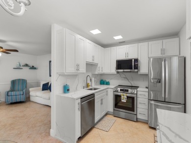 Welcome to this beautifully renovated, turn key, first-floor on The American Golf Club in Florida - for sale on GolfHomes.com, golf home, golf lot