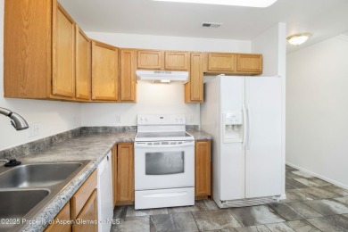 Charming and well-kept 3-bedroom, 2.5-bath townhome in the heart on Battlement Mesa Golf Course in Colorado - for sale on GolfHomes.com, golf home, golf lot