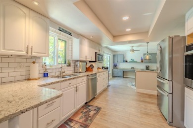 Under contract-accepting backup offers. Must-See Dunedin Pool on The Dunedin Country Club in Florida - for sale on GolfHomes.com, golf home, golf lot