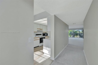 Breathtaking 2 bedroom, 2 bathroom corner unit with view on Flamingo Lakes Country Club in Florida - for sale on GolfHomes.com, golf home, golf lot